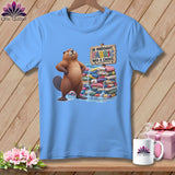 Light blue t-shirt with a beaver and stack of fabric, text reads 