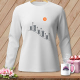 White long-sleeved shirt with sewing graphic and orange button detail.