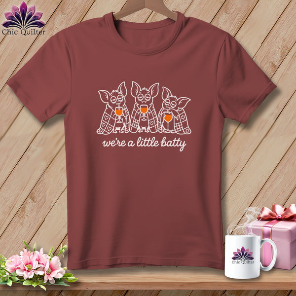 T-shirt with three cartoon bats holding wine glasses and text "we're a little batty."