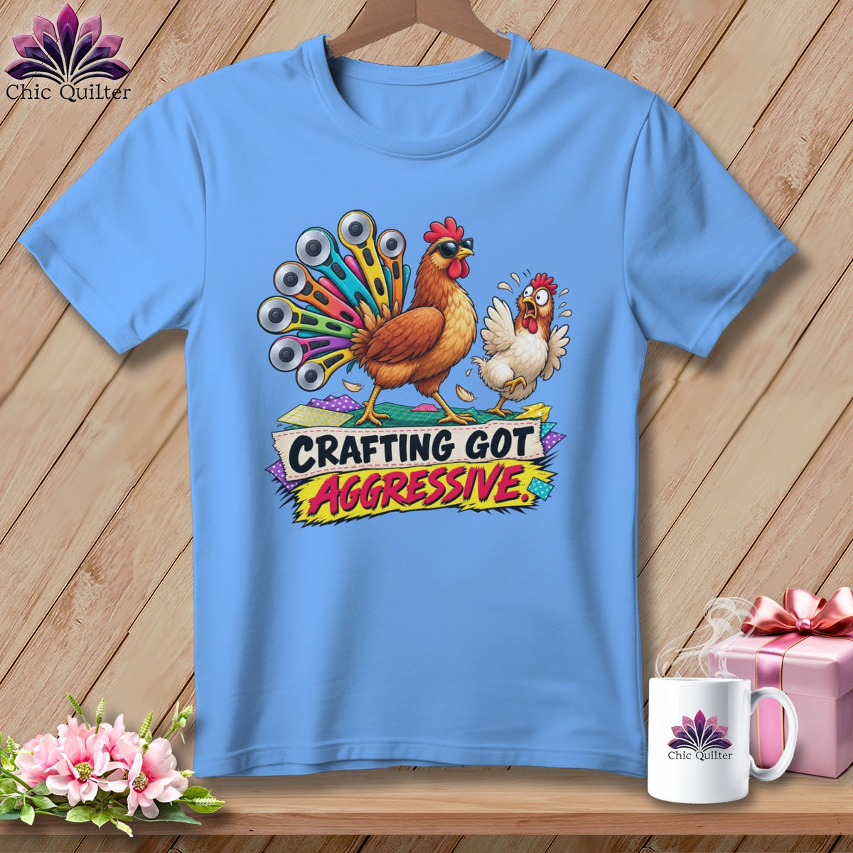 Light blue t-shirt graphic with chickens and text "CRAFTING GOT AGGRESSIVE".