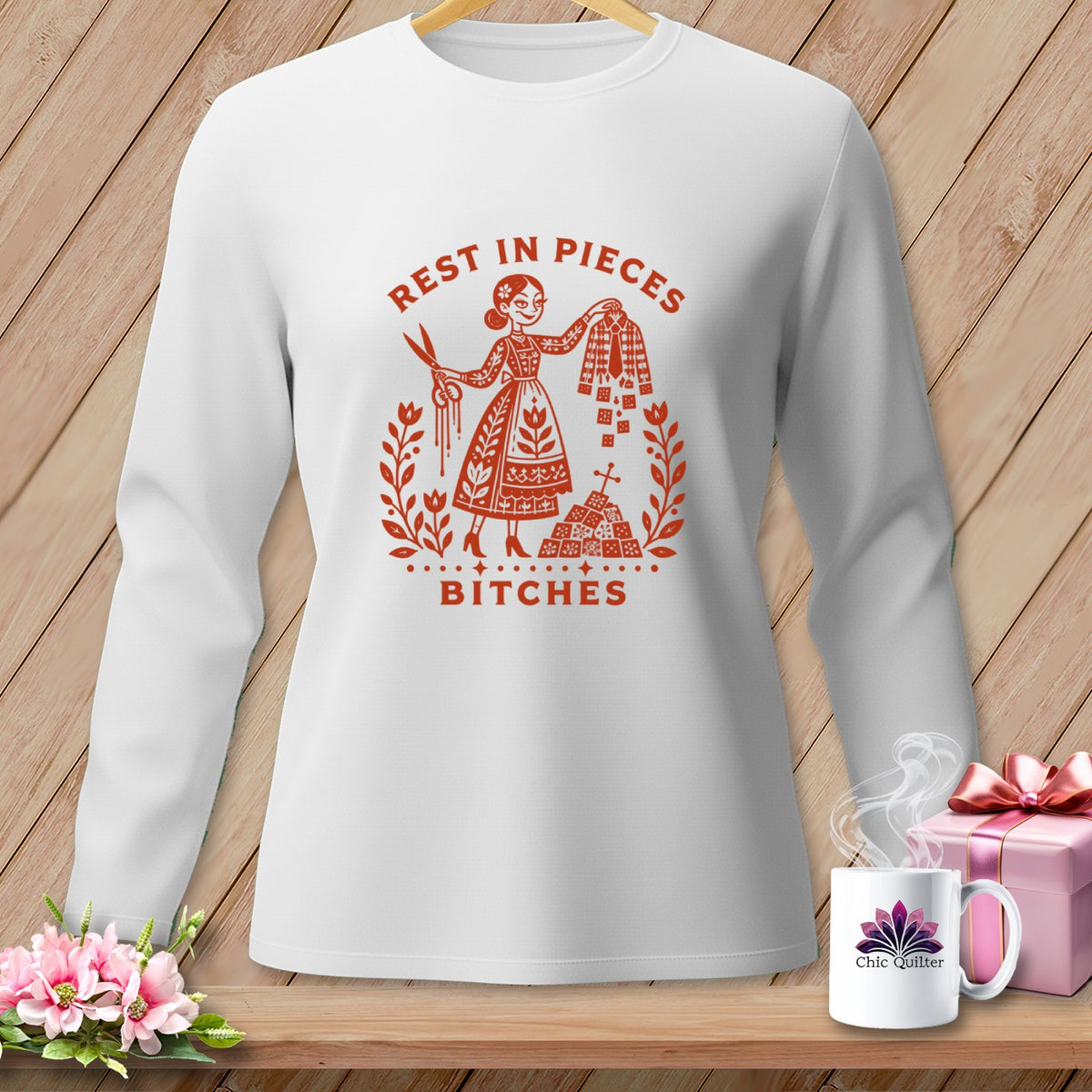 White long-sleeve shirt with "Rest in Pieces Bitches" graphic and a woman with scissors.