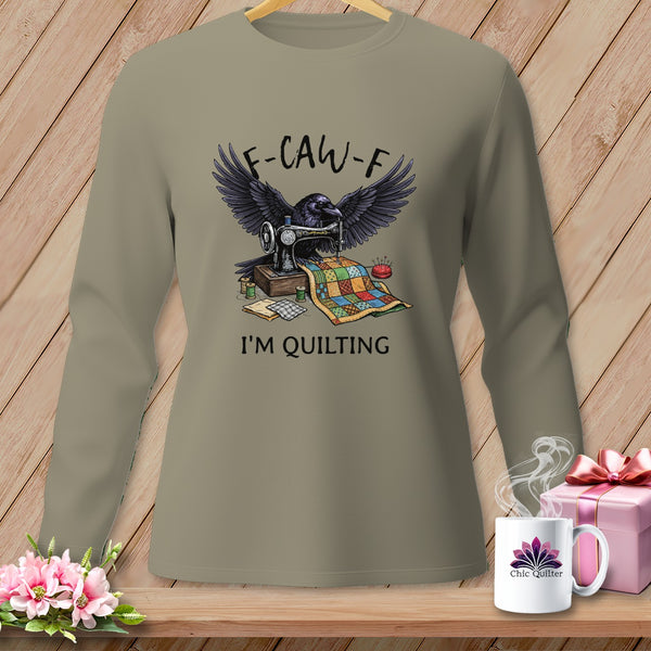 Raven at sewing machine with quilt, text "F-CAW-F I'M QUILTING".