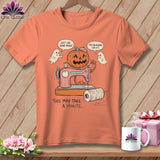 Orange t-shirt graphic with a pumpkin at a sewing machine, two ghosts, and text.