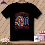 A black t-shirt features a graphic with stacked quilts, a coffee mug, and the text Denver Quilter, First Down, Sew On!