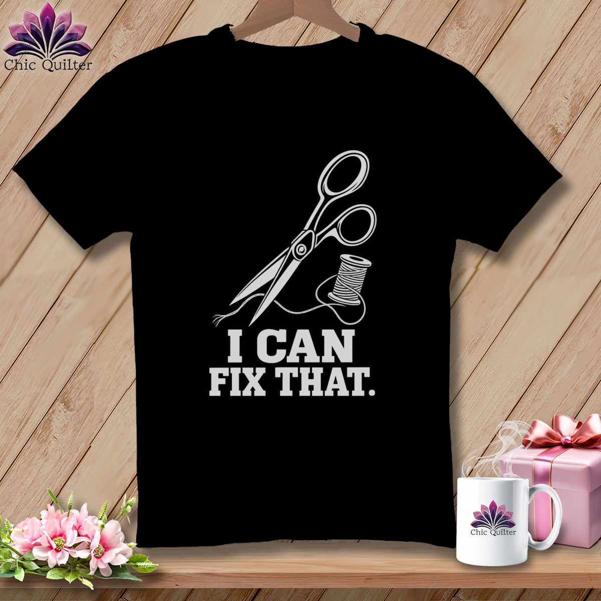 Black t-shirt with white scissors, thread, and text "I CAN FIX THAT."