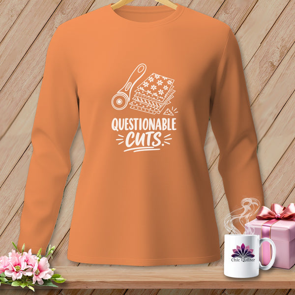 Orange long-sleeve shirt with a rotary cutter and fabric graphic and "Questionable Cuts" text.