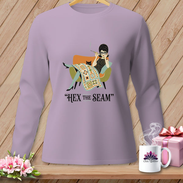 Graphic of a woman and cat on a purple long-sleeve shirt with "HEX the SEAM" text.