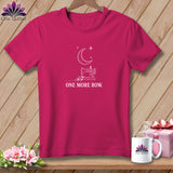 Pink t-shirt with white sewing machine, crescent moon, stars, and text.