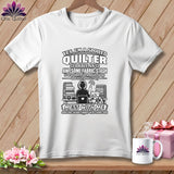 A white t-shirt featuring black text about quilting, with a silhouette of a quilter surrounded by fabric.