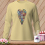 Light yellow long-sleeve shirt with a patchwork heart graphic.