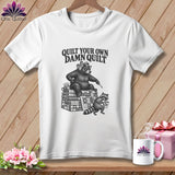 A white t-shirt featuring a black graphic of a bear and raccoon with a quilt and the text Quilt Your Own Damn Quilt.