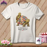 T-shirt with two turtles, one wearing glasses and a quilt-patterned shell. Text reads 