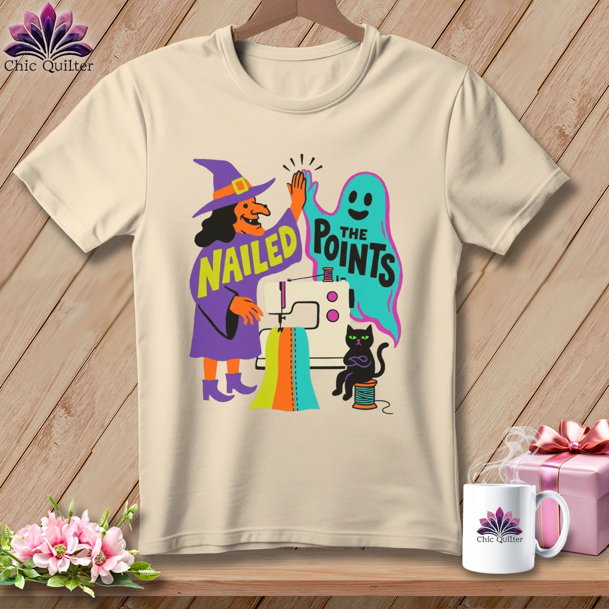 Witch and ghost high-five with sewing machine and text "Nailed the Points".