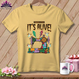 Yellow t-shirt with a Frankenstein-stitch sewing machine, ghosts, and 