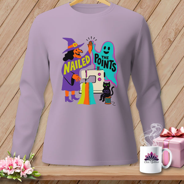 Witch and ghost high-five over sewing machine, "Nailed the Points" text.