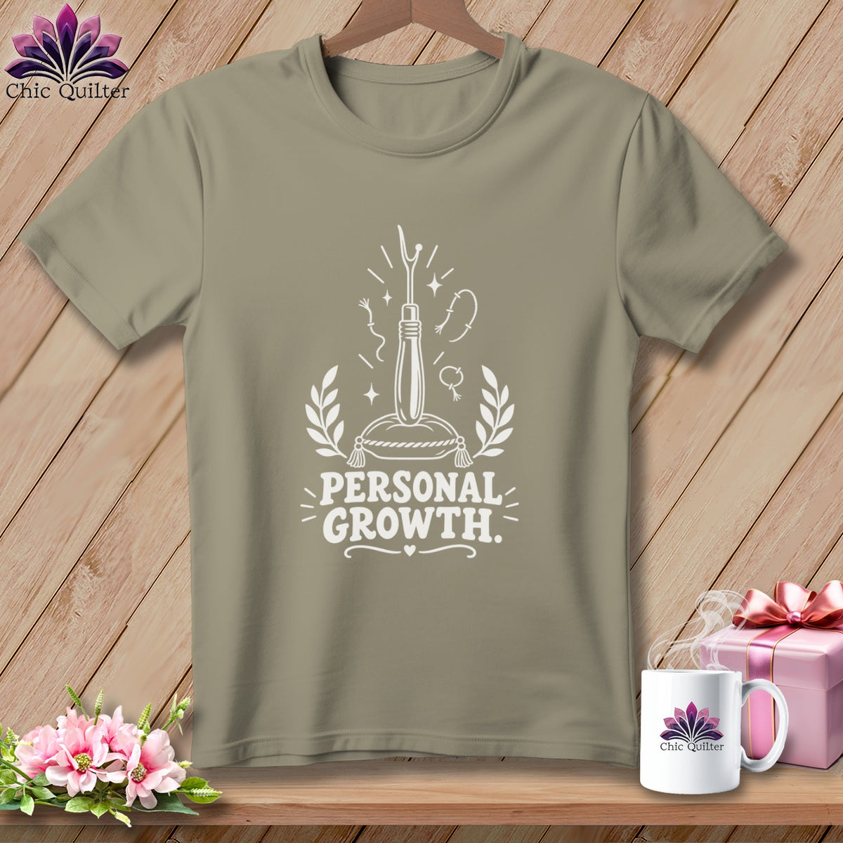T-shirt with white graphic of seam ripper and text "PERSONAL GROWTH."