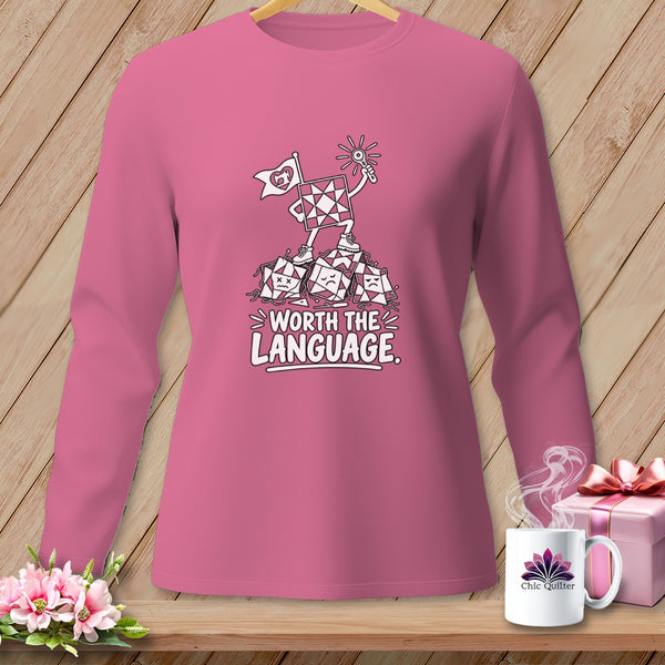 Pink long sleeve shirt with cartoon quilt blocks and "Worth the Language" text.