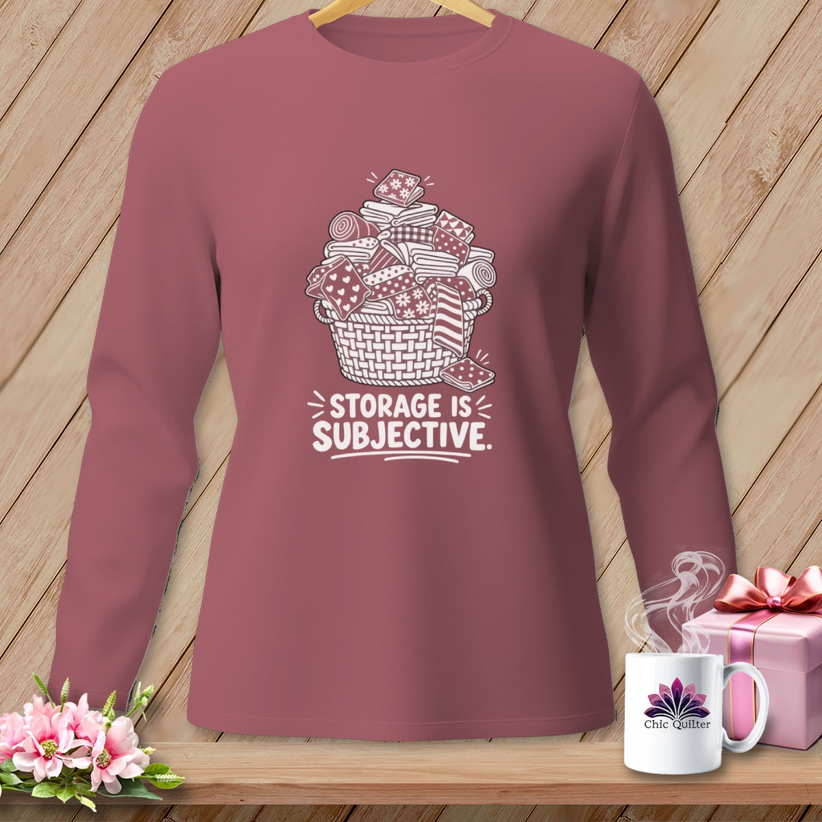 Long sleeve shirt with a graphic of a basket of folded fabric and text "STORAGE IS SUBJECTIVE."