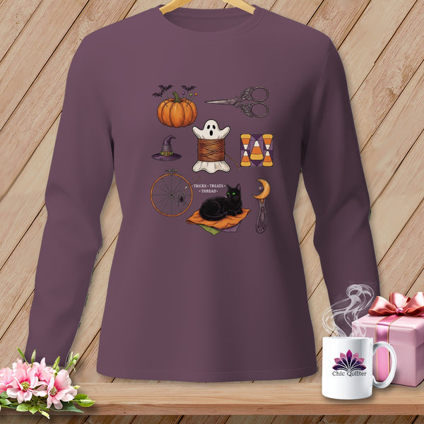 Long-sleeve shirt featuring Halloween-themed sewing items, including a pumpkin, ghost, and black cat.