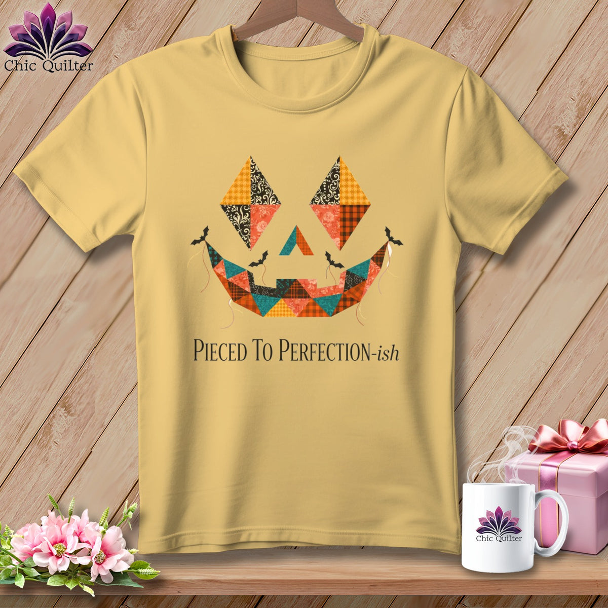 Yellow t-shirt with a patchwork jack-o'-lantern face and "Pieced To Perfection-ish" text.