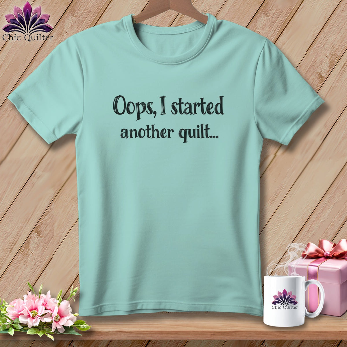 Light blue t-shirt with "Oops, I started another quilt..." text and Chic Quilter logo.