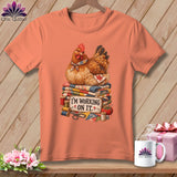 Salmon t-shirt with a chicken sitting on quilts and the text 
