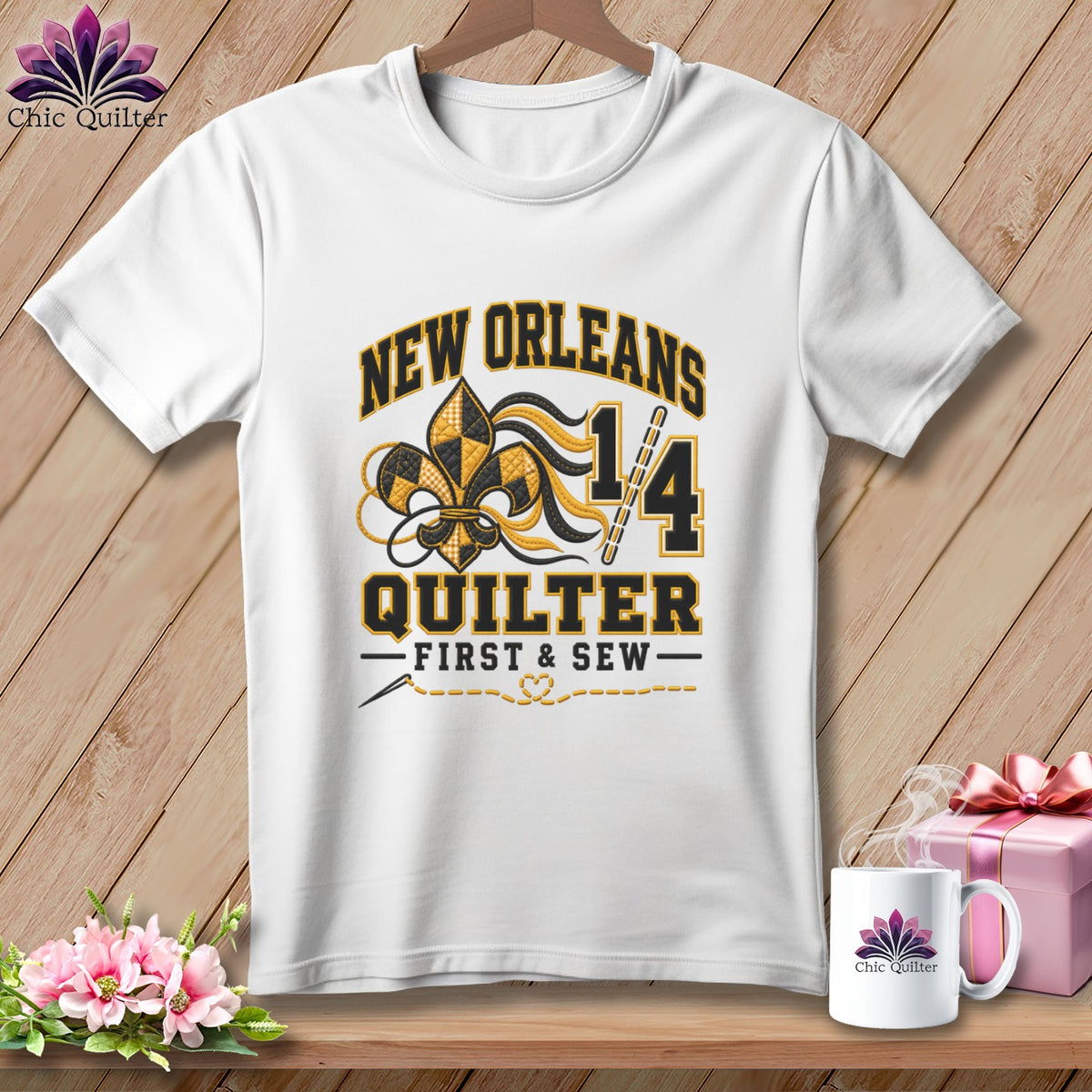 White t-shirt with a New Orleans Quilter graphic featuring a fleur-de-lis, numbers, and text.
