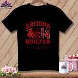 Black t-shirt featuring a red cardinal illustration, the text Arizona Quilter, and a sewing needle graphic.