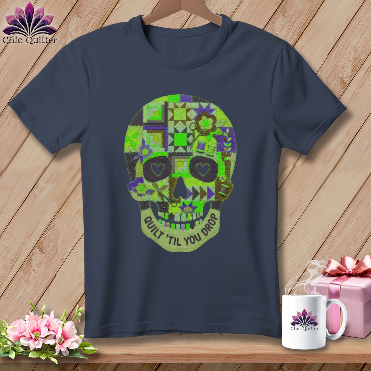 Navy t-shirt with a quilted skull design and the text "Quilt 'til you drop".