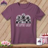 T-shirt with three women peeking over a quilt pattern, text 