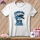 A white t-shirt hanging against a wooden background features a black panther, blue spools of thread, and the text Carolina 99 Stash League.