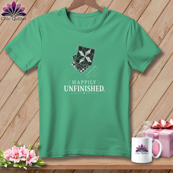 Teal t-shirt with patchwork quilt blocks graphic and text "HAPPILY UNFINISHED."