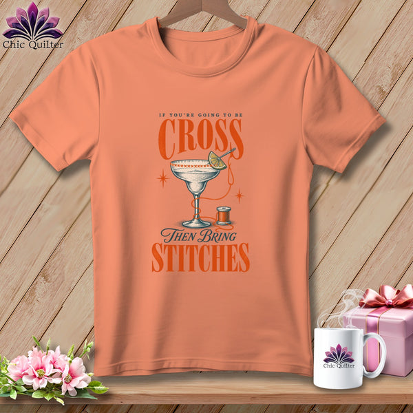 Peach t-shirt with "If you're going to be cross then bring stitches" text and graphic.