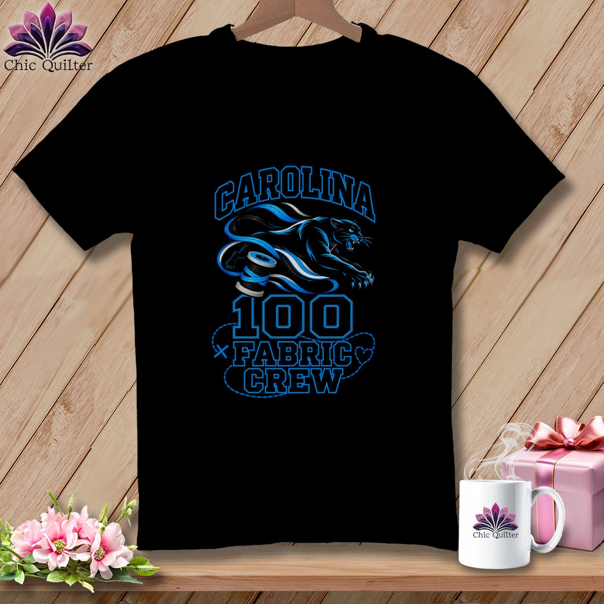 Black t-shirt featuring blue text reading Carolina 100 Fabric Crew alongside a panther graphic.