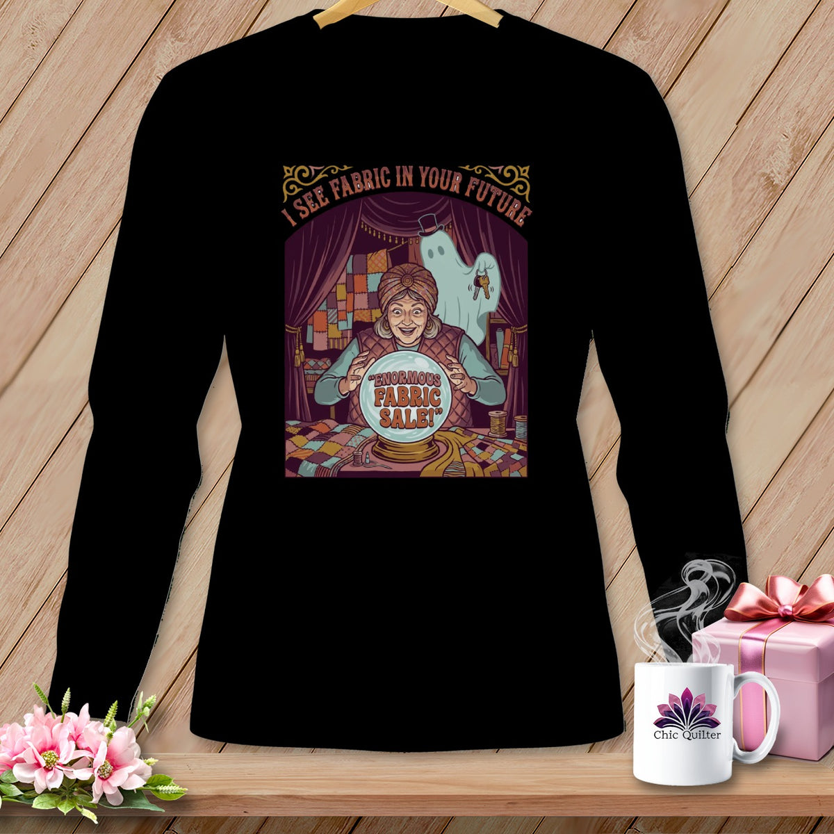 Black long sleeve shirt with a fortune teller graphic and "Enormous Fabric Sale!" text.