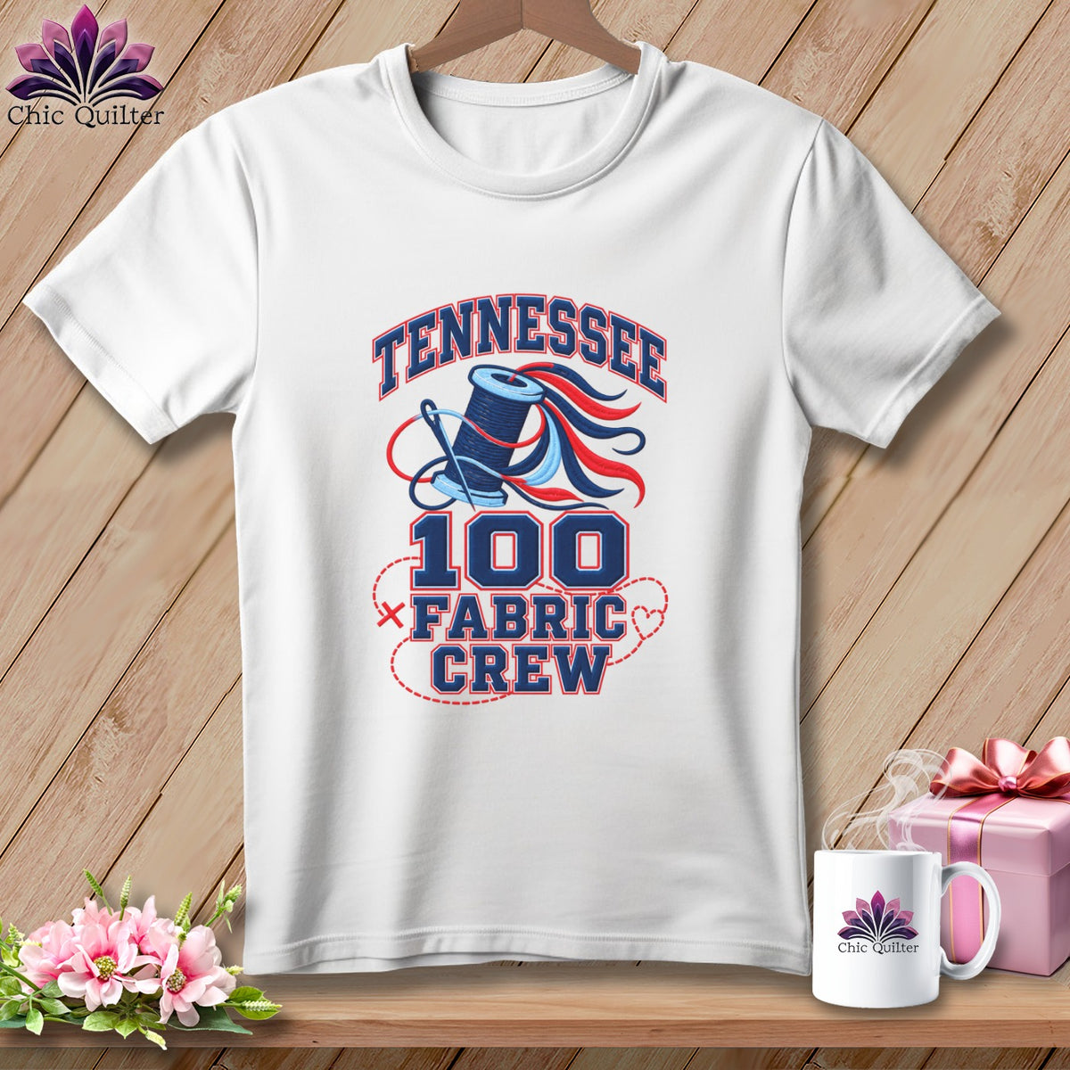 White t-shirt featuring a Tennessee 100 Fabric Crew graphic with a spool of thread.