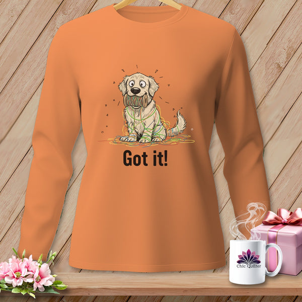 Orange long-sleeve shirt with cartoon dog tangled in yarn, says "Got it!".