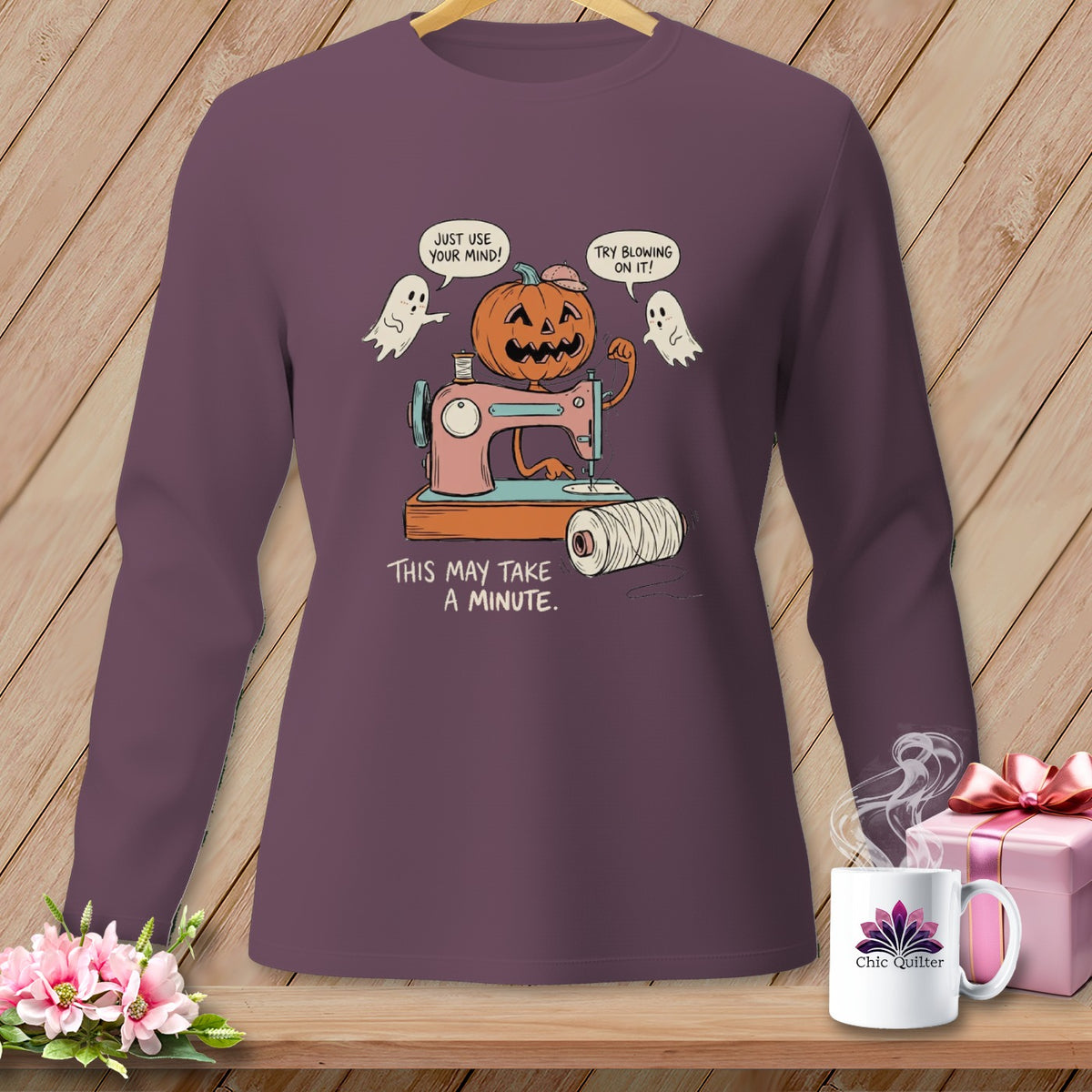 Halloween pumpkin and ghosts with sewing machine saying "This may take a minute."