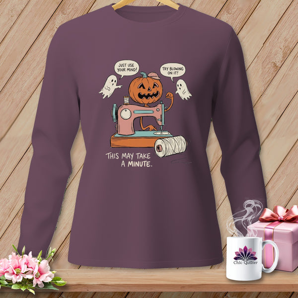 Halloween pumpkin and ghosts with sewing machine saying "This may take a minute."