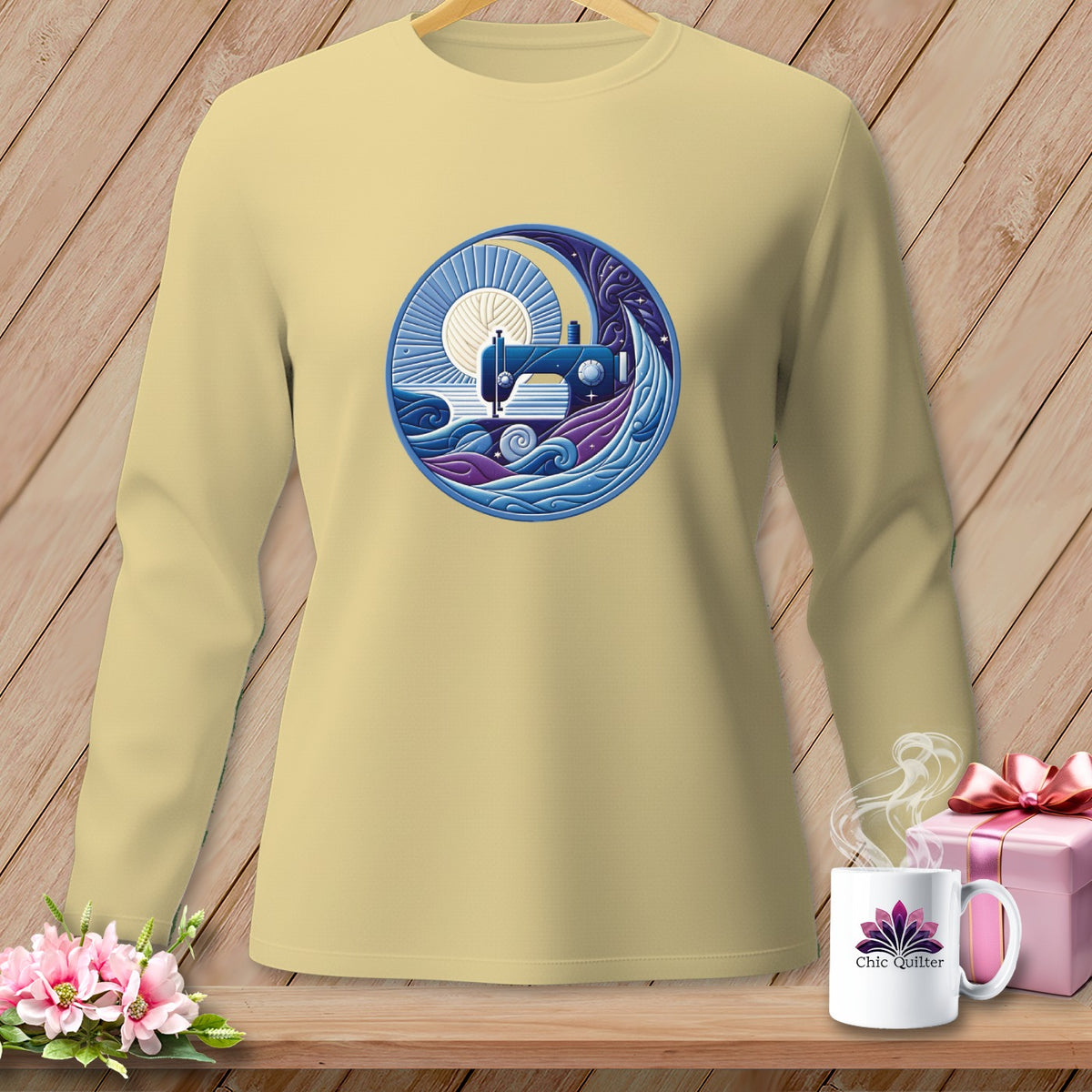 Long sleeve yellow t-shirt with a circular graphic of a sewing machine under a moon.