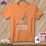 Orange t-shirt with scissors and thread graphic, reads 