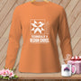 Orange long-sleeve shirt with a quilt block graphic and "Technically a Design Choice" text.