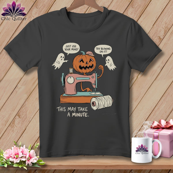 Halloween pumpkin and ghosts using a sewing machine, with text.