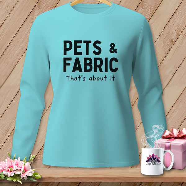 Aqua long-sleeve shirt with black text "PETS & FABRIC That's about it"
