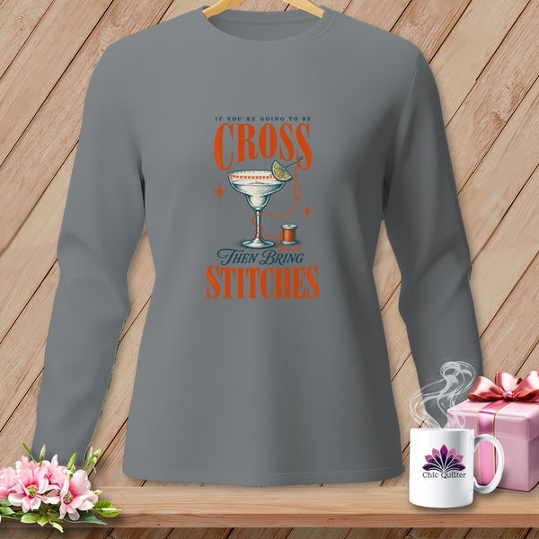 Long sleeve gray shirt with "If you're going to be cross then bring stitches" text and cocktail glass graphic.