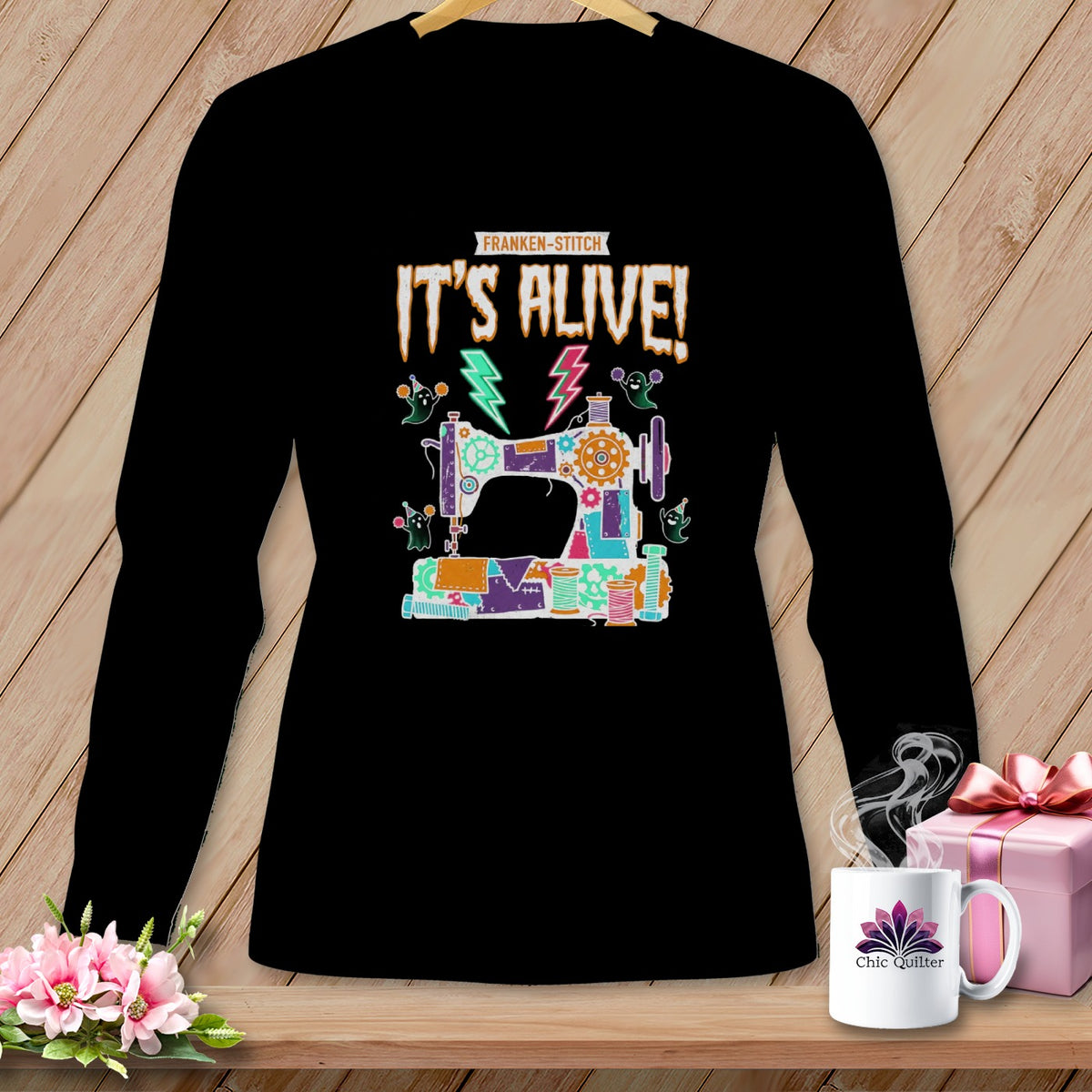 Black long-sleeve shirt with "IT'S ALIVE!" and a Franken-sewing machine design.