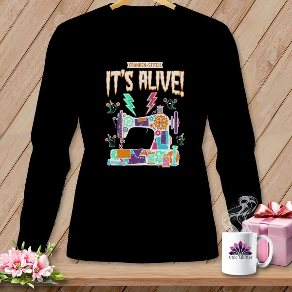 Black long-sleeve shirt with "IT'S ALIVE!" and a Franken-sewing machine design.
