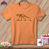 An orange t-shirt displays a graphic of a dinosaur skeleton wearing a patchwork quilt.
