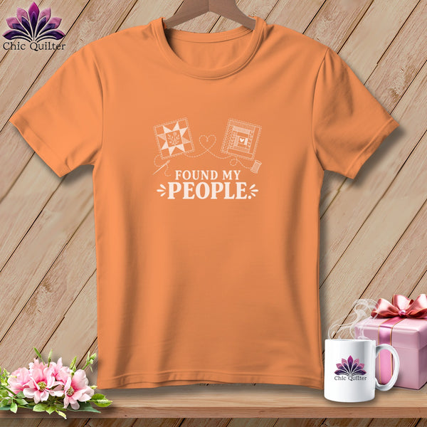 Orange t-shirt with "Found My People" text and quilt block graphics.