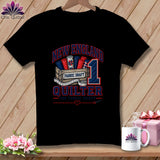 Black t-shirt featuring a New England Quilter graphic with fabric bolts, a wooden crate, and a large number one.